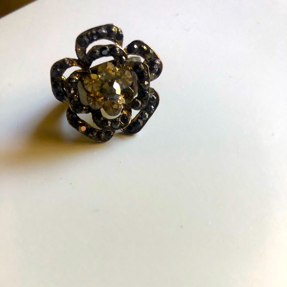 Black flowered ring.